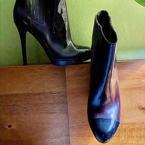 Brian Atwood size eight, reddish,brown ankle boot with black capped toe